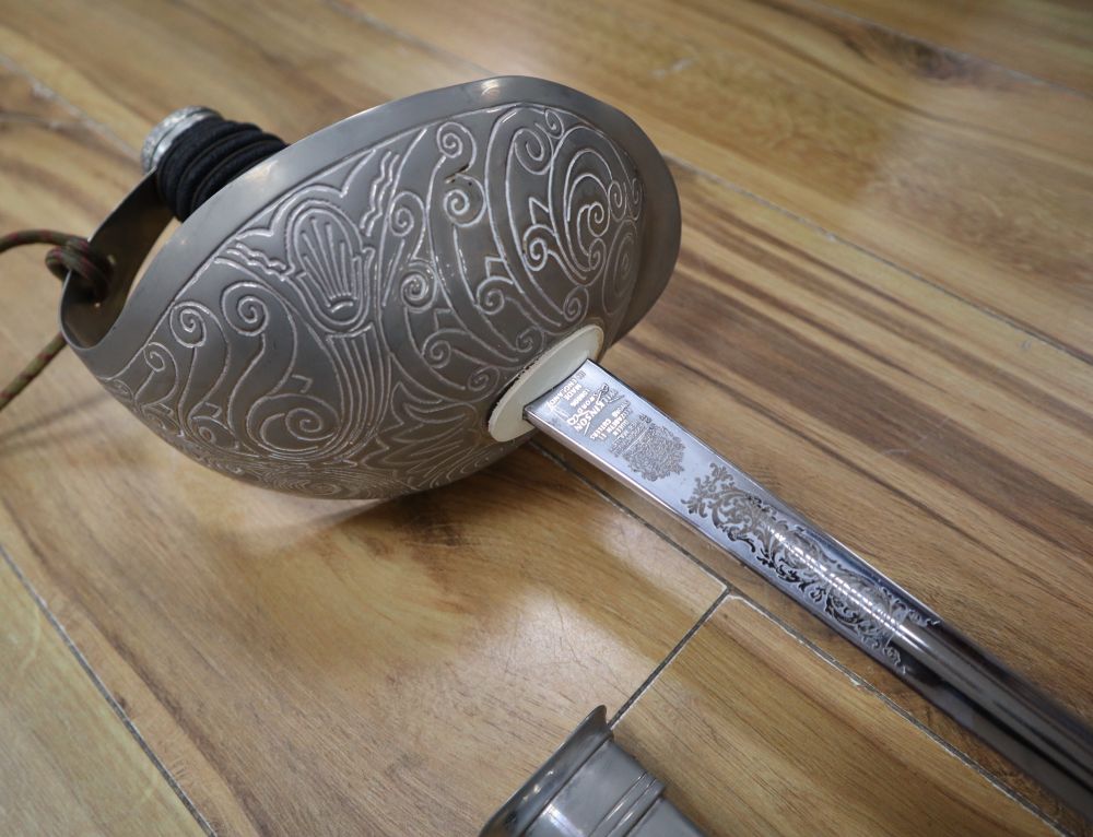 An officers sword, shagreen grip and 88cm etched, single-edged blade, in scabbard